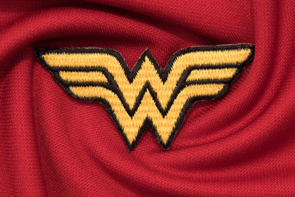 Wonder Woman logo fabric yellow on red background